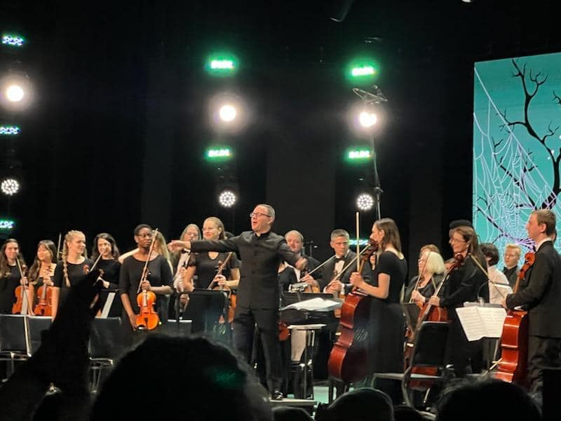 Composer Brian Balmages receiving an ovation