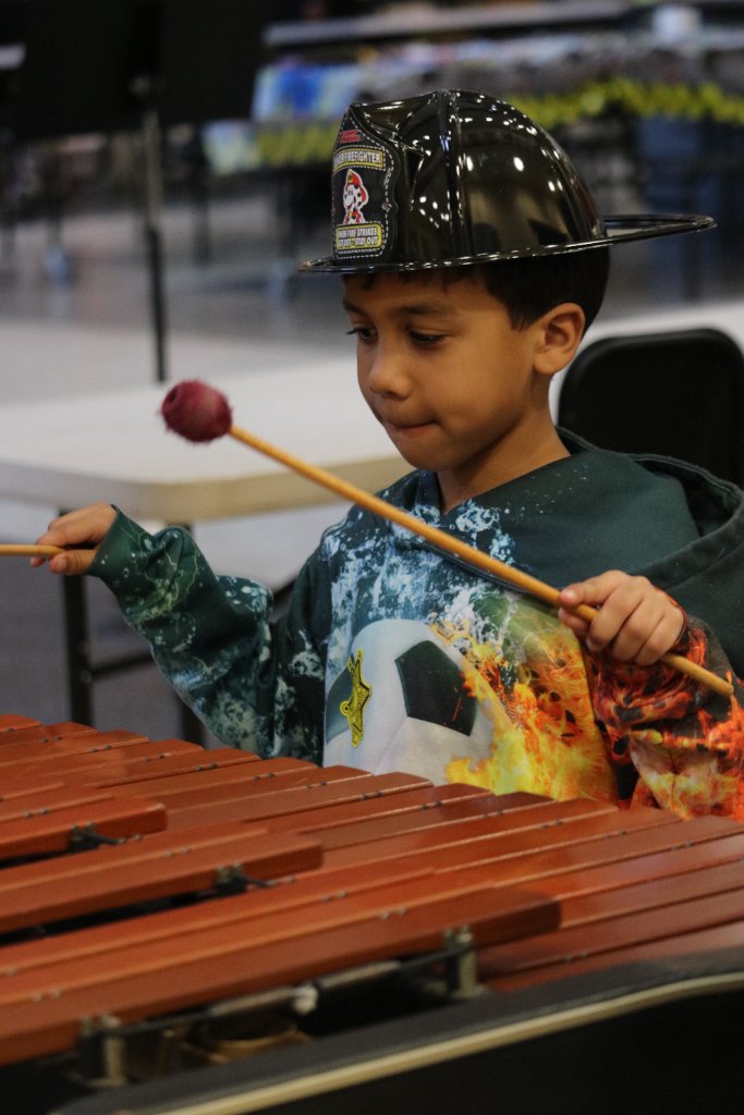 Learning the xylophone at Lolli-Pops